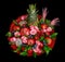 Colorful bright unique bouquet of flowers and fruits isolated on black background