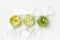 Colorful bright wrapped round lollipops over white background