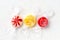 Colorful bright wrapped round lollipops over white background