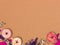Colorful brown carnival background with donuts and other funny items