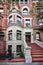 A colorful brownstone building and stoop