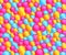 Colorful bubble ball pit background filled with fun pink, yellow, blue bubbles