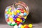 Colorful Bubble Gum Balls in Glass Cannister Black Background