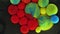 Colorful bubbles. Abstract red, yellow, blue, green mixture on a black background. Artistic color paint background.