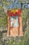 A colorful Buddhist tapestry hangs from a tree atop Meditation Mount in Ojai, CA