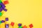 Colorful building toy blocks with yellow space on the upper portion for text