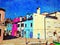 The colorful buildings on the canals of Burano in Venice