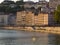 Colorful buildings washed with sun on the Rhone river bank at Ly