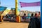 A colorful bumper car carnival ride with a purple tarp on top at Santa Monica Pier