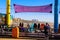 A colorful bumper car carnival ride with a purple tarp on top at Santa Monica Pier