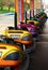 Colorful bumper cars aligned and ready for customers