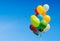 Colorful bunch of helium balloons isolated on background