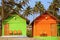 Colorful Bungalows on a Palm Beach in Goa, India.