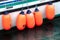 Colorful buoys on the side of a fishing boat.
