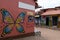Colorful butterfly shop wall in a cobblestone road in the small quaint town of  CaetÃª-AÃ§u, Chapada Diamantina, Brazil