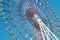 Colorful cabins on a Ferris wheel, blue sky