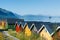 Colorful camping cabins on the fjord shore