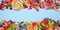 Colorful candies, top view double border with a blue banner background