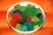 Colorful canned moss in a large white plate for interior decoration