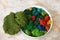 Colorful canned moss in a large white plate for interior decoration
