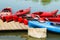 Colorful canoes and kayaks lying on the jetty