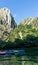 Colorful Canoes in Matka Canyon, Macedonia with no person. Kayaks in a pier and sunset in the mountains and lake