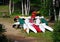 Colorful canoes and a picnic table