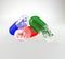 Colorful capsules set on the white