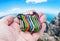 Colorful carabiner climbing in hand