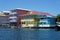 Colorful Caribbean houses over water with boats