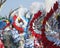 Colorful carnival background with bright feather headdresses.Small parade of dancers in festival costumes who celebrate Carnival