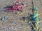 Colorful carnival background, garlands and confetti on asphalt