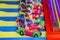 A colorful carnival game with little clown figures in cars at the Santa Monica Pier