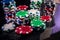 Colorful casino chips on dark background closeup