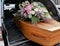 A colorful casket in a hearse or church before funeral