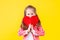 Colorful casual child girl isolated on yellow background