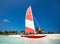 Colorful catamaran on the white sands of beach