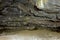 Colorful Ceiling and Sandy Floor of Lava Tube Cave