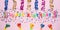 Colorful celebration background with various party confetti and candle decoration. Minimal birthday concept. Flat lay