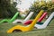 Colorful cement chairs in a public park
