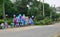 Colorful cement flower pots stacked up on the side of road