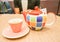 Colorful ceramic teapot with cup and saucer