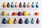 colorful ceramic vases lined up on white shelf