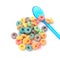 Colorful cereal and plastic spoon