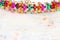 Colorful chain garland over white wooden background. Traditional jewish sukkot holiday decoration