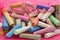 Colorful chalk for children.Blue, yellow, pink, orange.