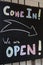 Colorful chalk sign `open`