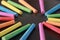 Colorful Chalks On Blank Blackboard