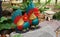 Colorful chicken models, decorated in a garden