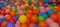 Colorful child balls. Multi-colored plastic balls. Achildren`s playroom. Background texture of multi-colored plastic balls on